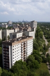 chernobyl 77 pripyat ghosttown rooftop view on the city and the reactor.jpg